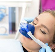 Woman with nitrous oxide dental sedation nasal mask