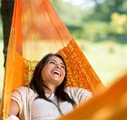 woman relaxing in hammock   