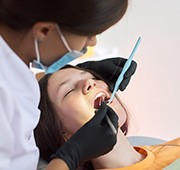 a woman receiving dental care while sedated