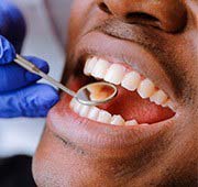 Patient with toothache in Salem visiting their emergency dentist