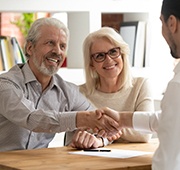 Couple shakes hands with dentist in Salem