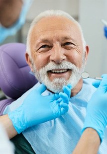 a patient smiling after undergoing restorative dentistry