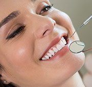 Woman receiving preventive dentistry exam