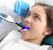 Young girl receiving children's dentistry treatment