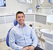 Smiling man in dental chair