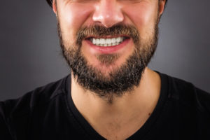 close-up of man grinding his teeth