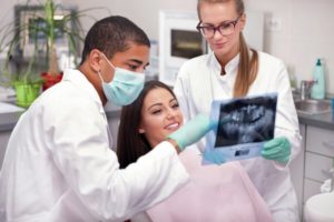 dentists treating a female patient