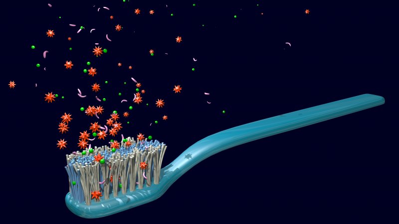 a digital image of a toothbrush and germs falling onto it